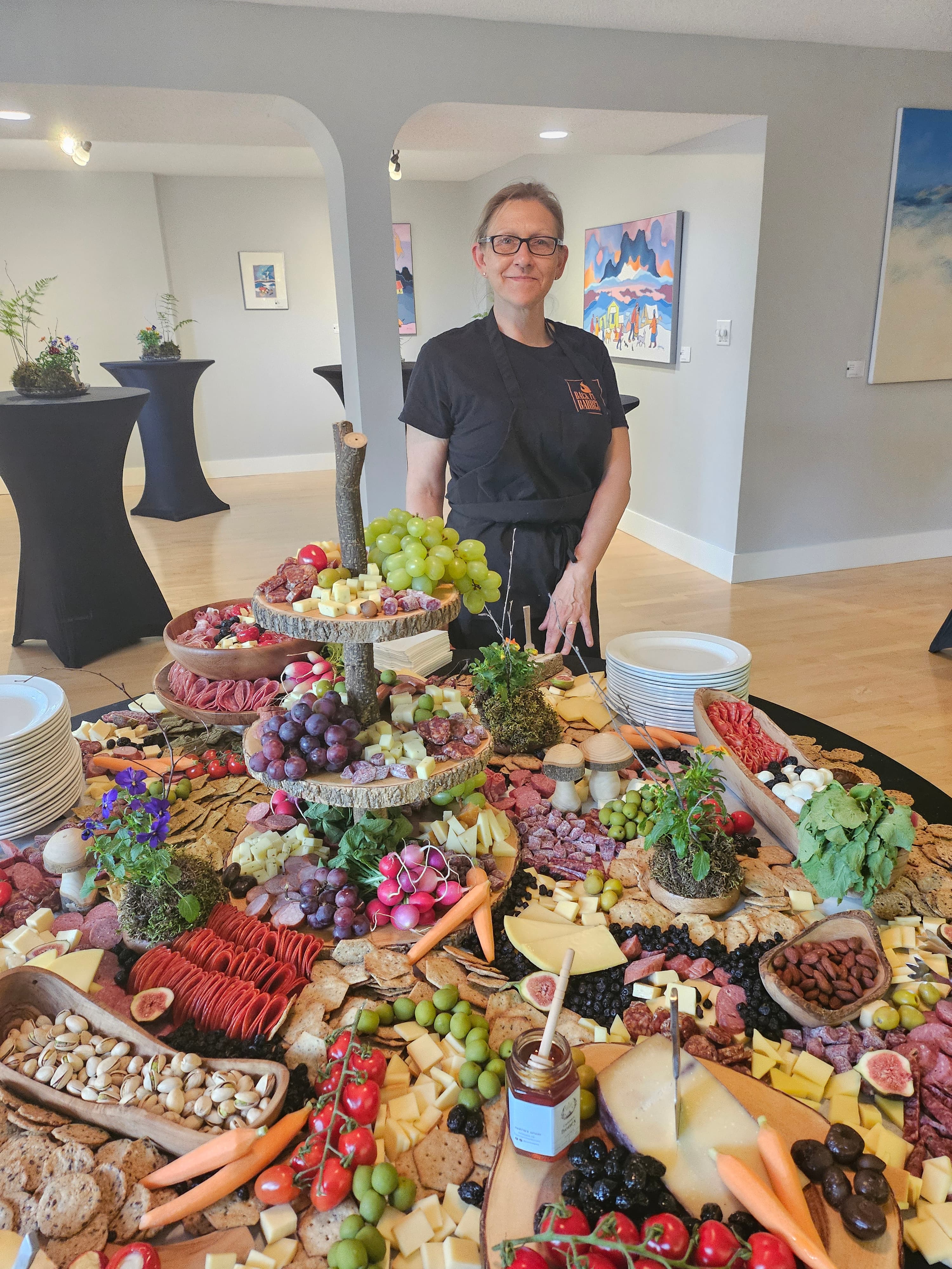 Michelle McKay with a Back Forty charcuterie table at AU House