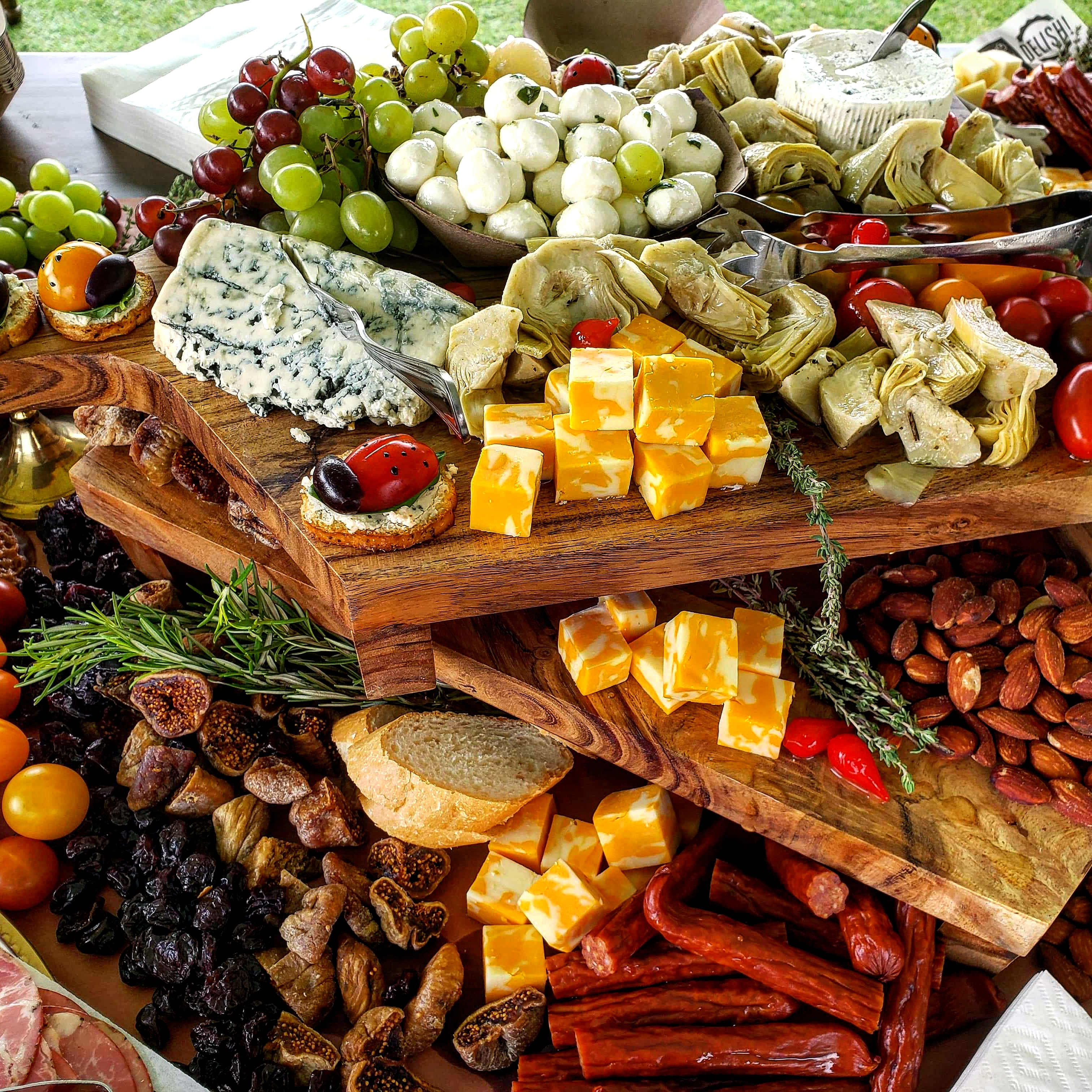 Close-up of a Back Forty Barbeque grazing table with cheese, fruit, nuts, and cured meats